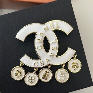 CHANELLY Gold and Cream Logo Brooch